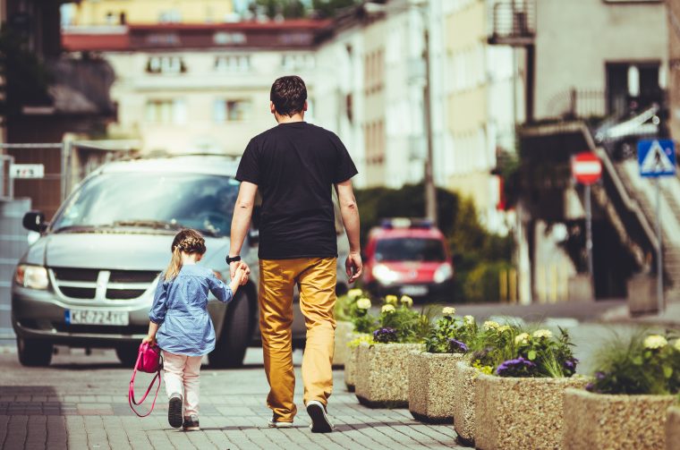 Dad takes his daughter to school